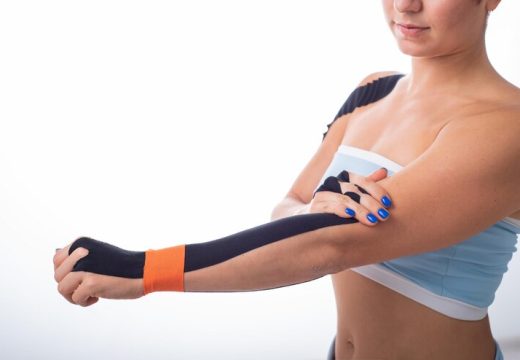 female-athlete-puts-kineziotape-her-wrist-kineziology-alternative-treatment-injuries-joints-tendons-physiotherapy-chronic-inflammation-joints-womans-arm_182067-1894